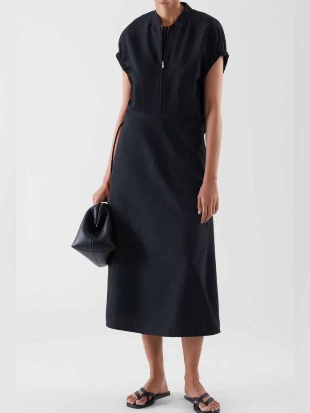 Dark navy COS seersucker midi dress featuring a half-zip front cap sleeves